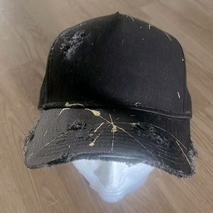 Custom snapbacks with gold paint splatter